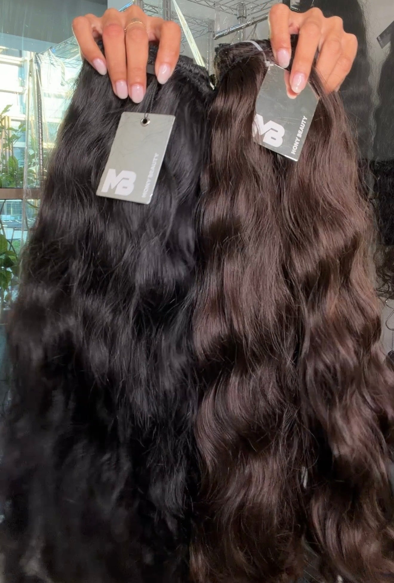 Two bundles of Loose wavy hair extensions in black & brown